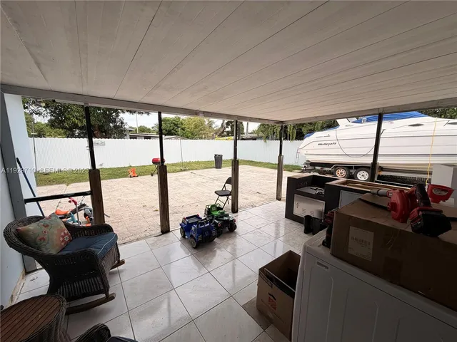 a kitchen with a sink a counter top space a washer and dryer