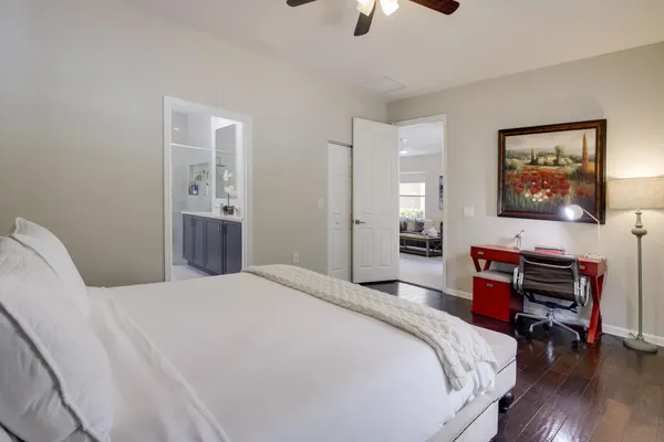 a bathroom with a white bath tub a shower and a sink