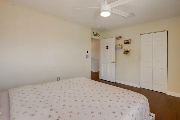 a bathroom with a double vanity sink toilet mirror and shower