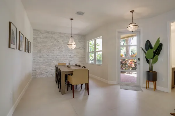 a dining room with furniture and window