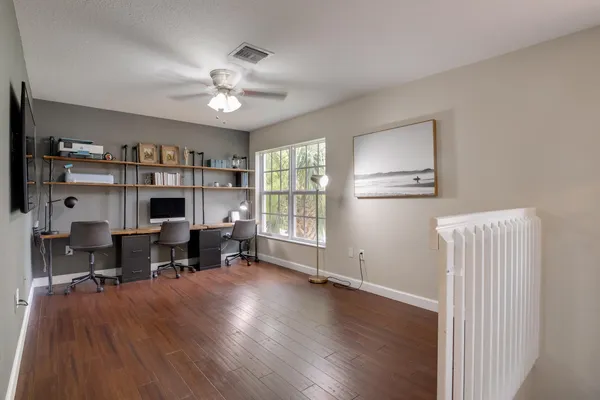 a view of a livingroom with wooden floor