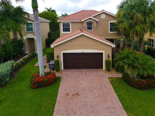 an aerial view of a house with outdoor space and pool