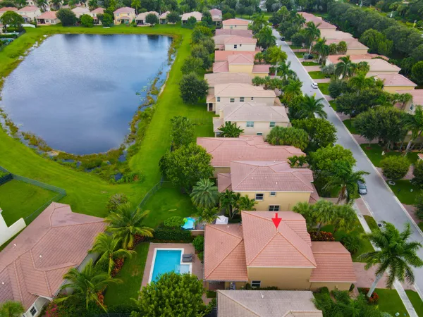 an aerial view of house with yard