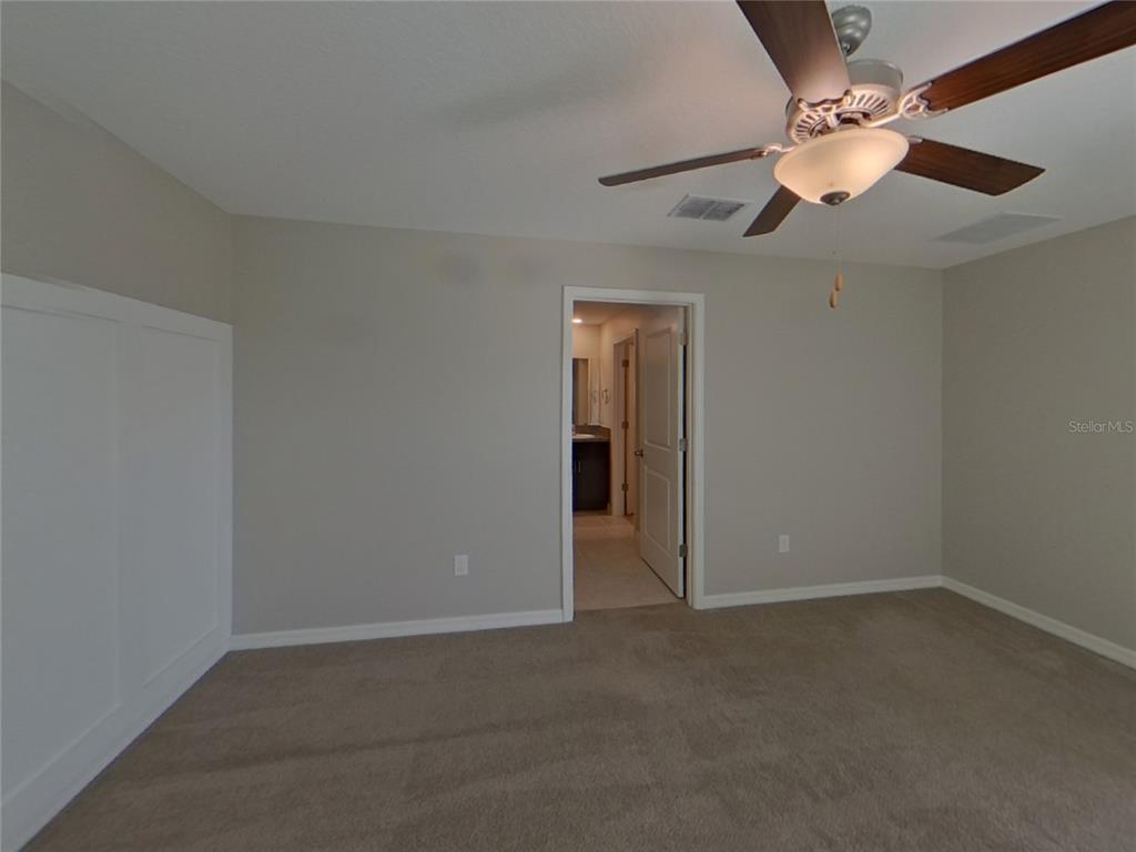 Undisclosed Address Apollo Beach, FL 33572 - Photo 6 of 15 an empty room with a window and a fan