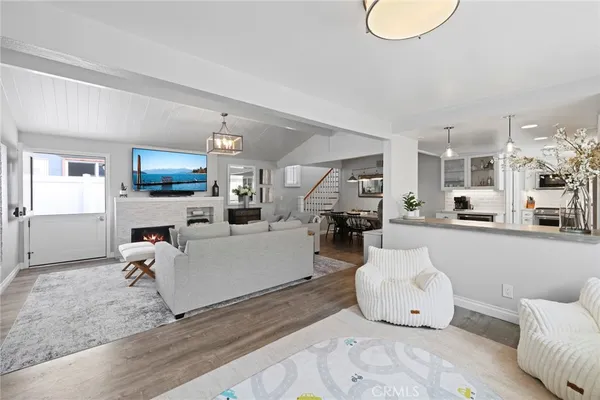 a living room with furniture and a dining table