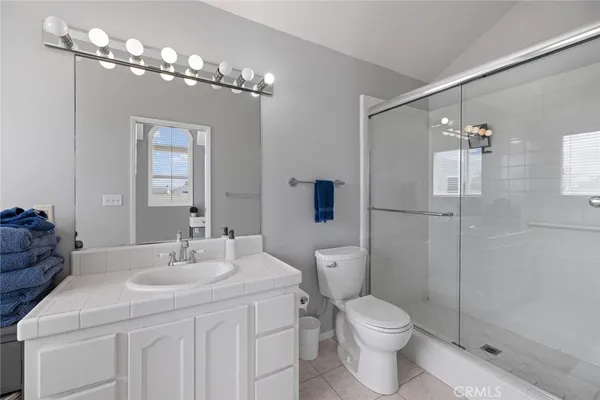 a bathroom with a toilet sink and shower