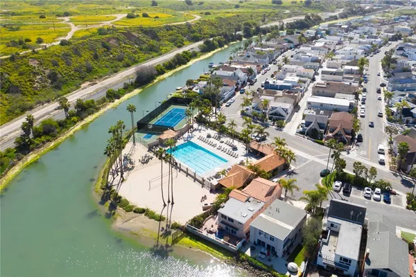 an aerial view of a house with a lake view