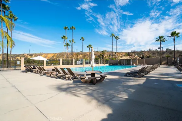 a view of a patio with table and chairs and potted plants