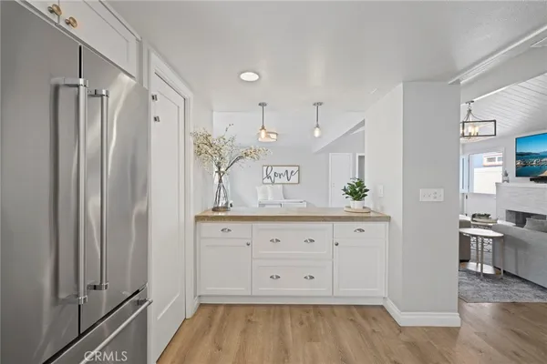 a view of a kitchen with wooden floor