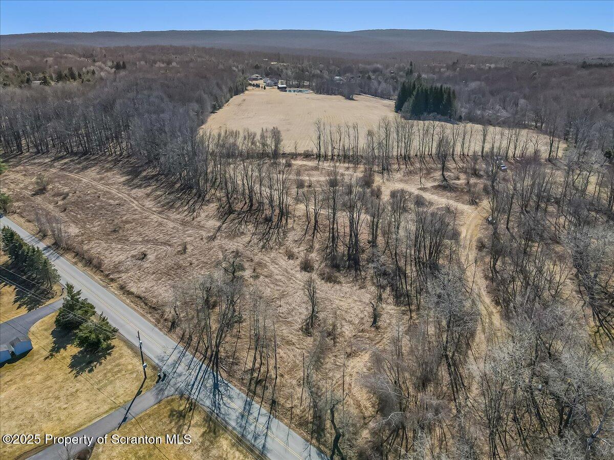 318 Road Spring Brook Moscow, PA 18444 - Photo 7 of 16 a view of a lake in middle of the town