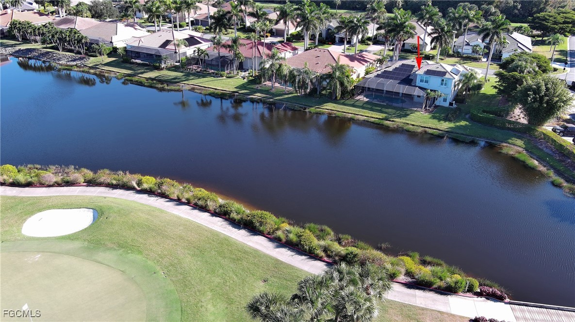 11066 Seminole Palm Way Fort Myers, FL 33966 - Photo 4 of 46 an aerial view of residential houses with outdoor space and lake view