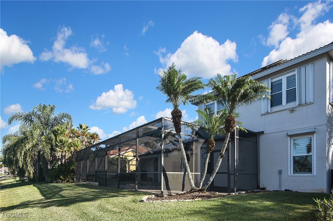 11066 Seminole Palm Way Fort Myers, FL 33966 - Photo 46 of 46 a front view of a house with swimming pool and trees