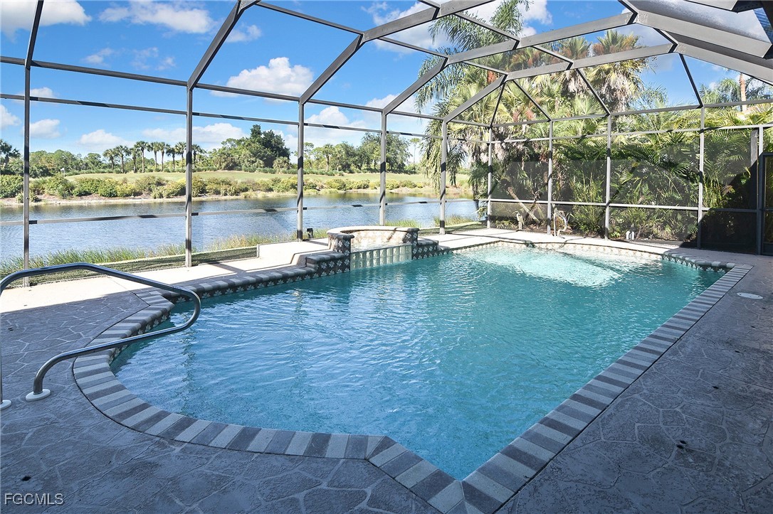 11066 Seminole Palm Way Fort Myers, FL 33966 - Photo 5 of 46 a view of a swimming pool with a patio