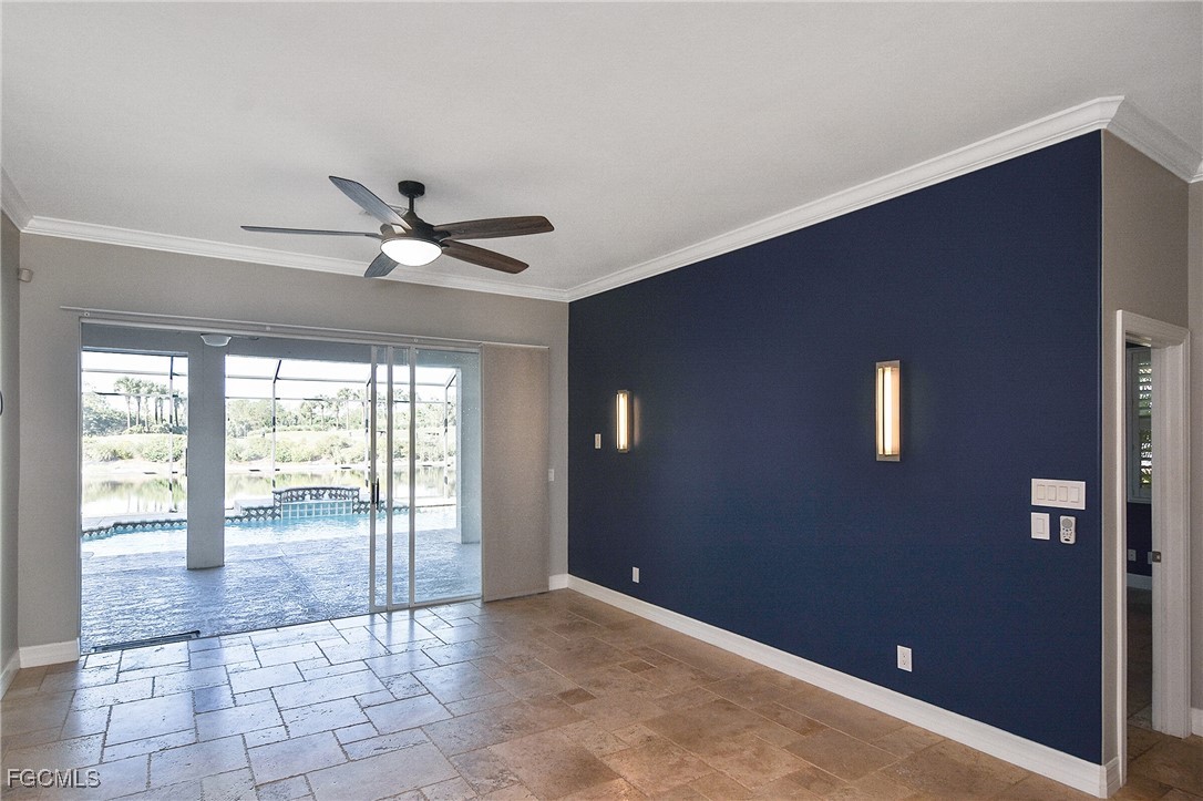 11066 Seminole Palm Way Fort Myers, FL 33966 - Photo 7 of 46 a view of a livingroom with a ceiling fan and window