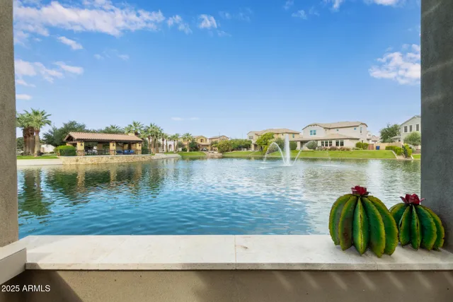 an aerial view of a houses with a swimming pool