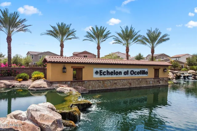 a view of a lake with houses in the back