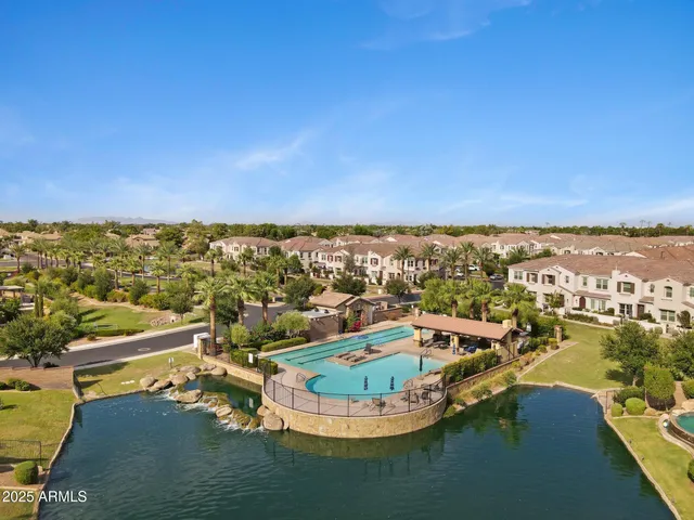 a view of a swimming pool and a chair