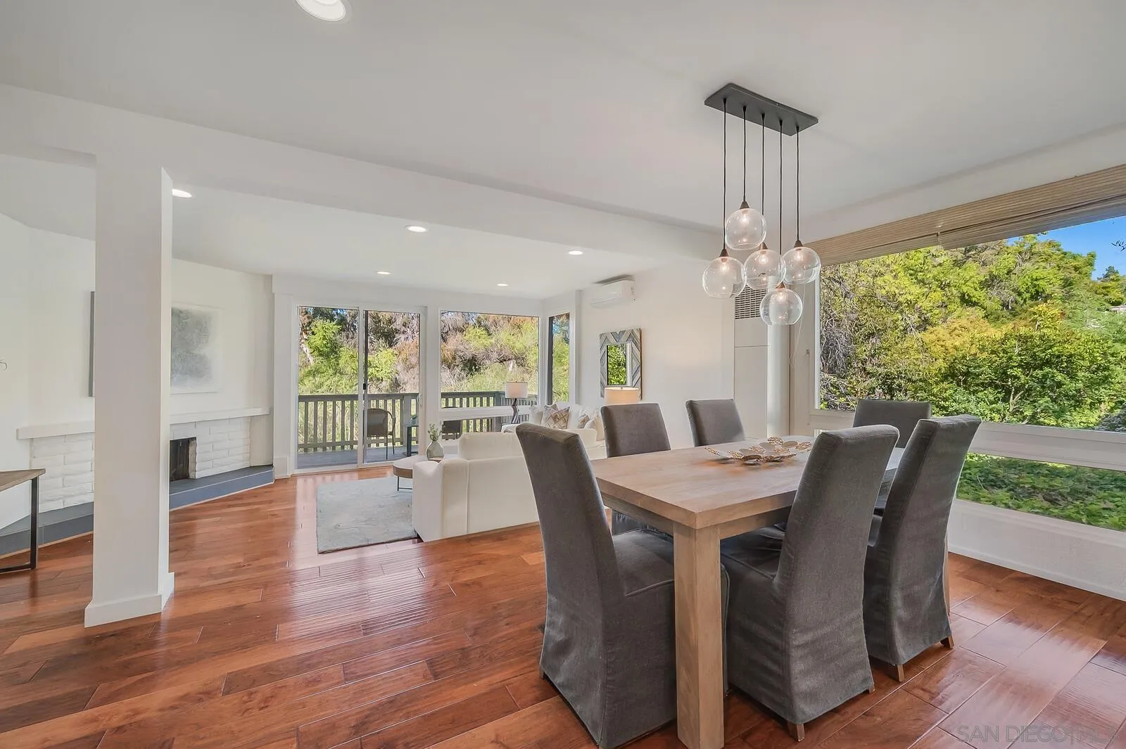 3040 Via De Caballo Encinitas, CA 92024 - Photo 12 of 39 a view of a dining room with furniture window and wooden floor