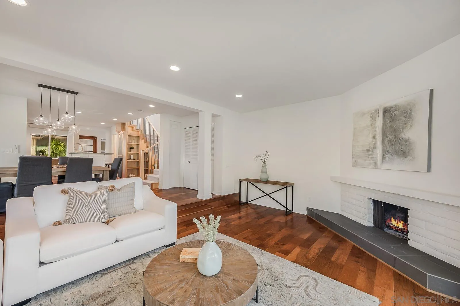3040 Via De Caballo Encinitas, CA 92024 - Photo 13 of 39 a living room with furniture and a fireplace
