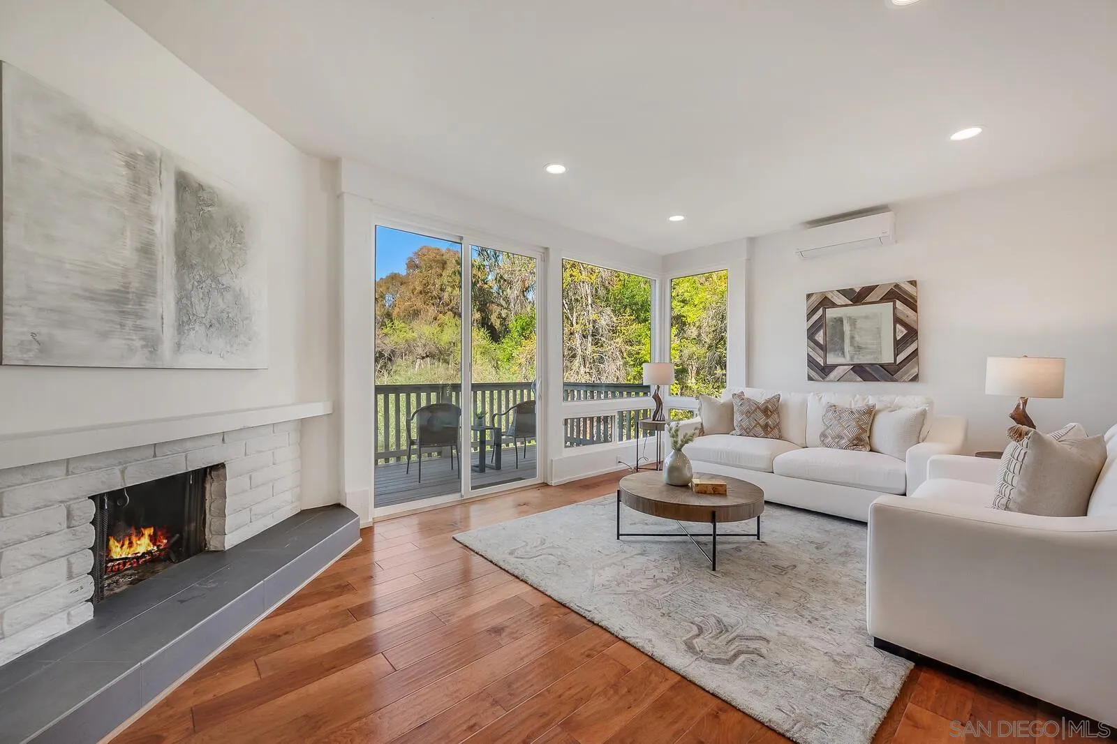 3040 Via De Caballo Encinitas, CA 92024 - Photo 14 of 39 a living room with furniture and a fireplace