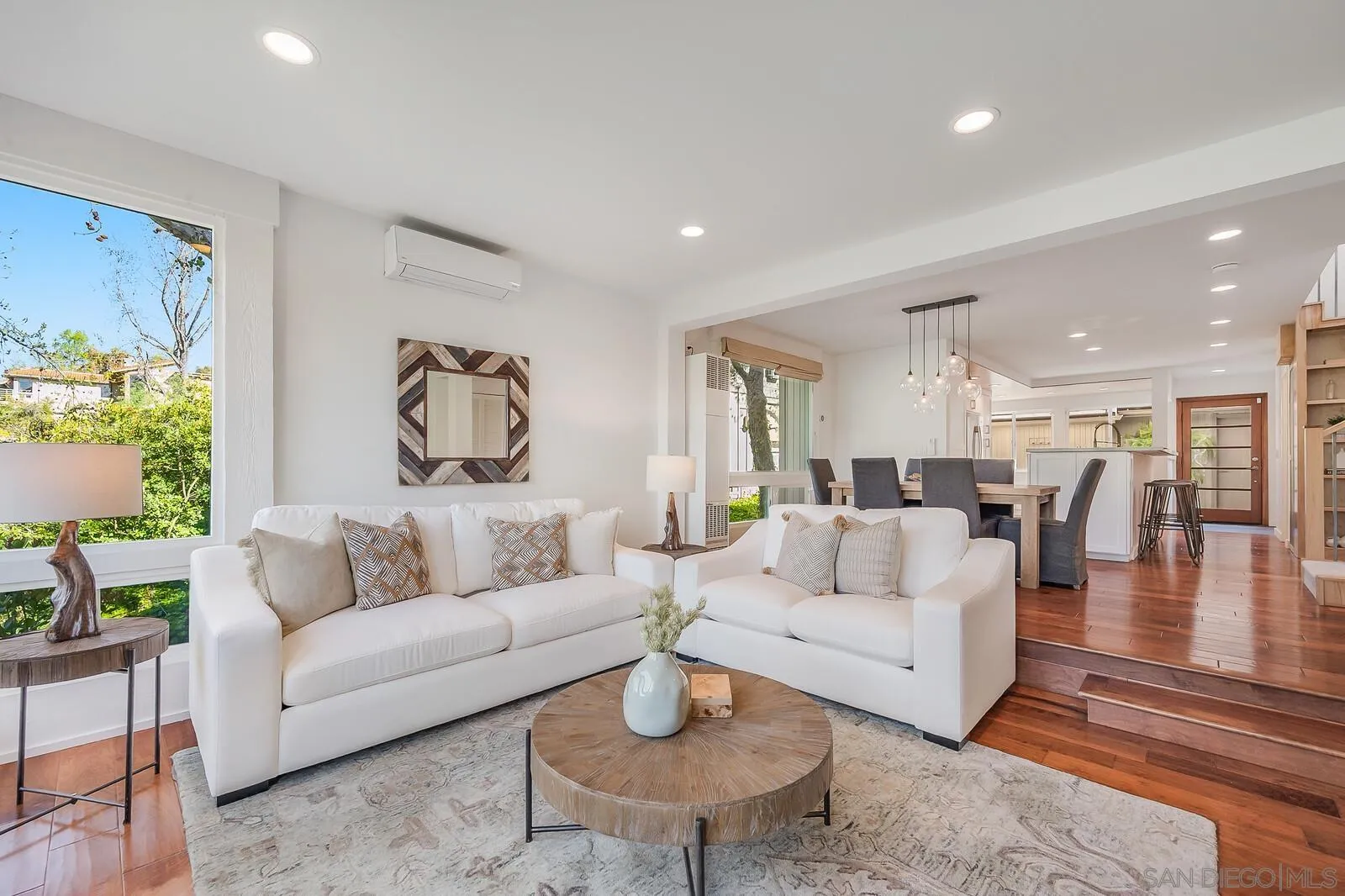 3040 Via De Caballo Encinitas, CA 92024 - Photo 16 of 39 a living room with fireplace furniture and a wooden floor