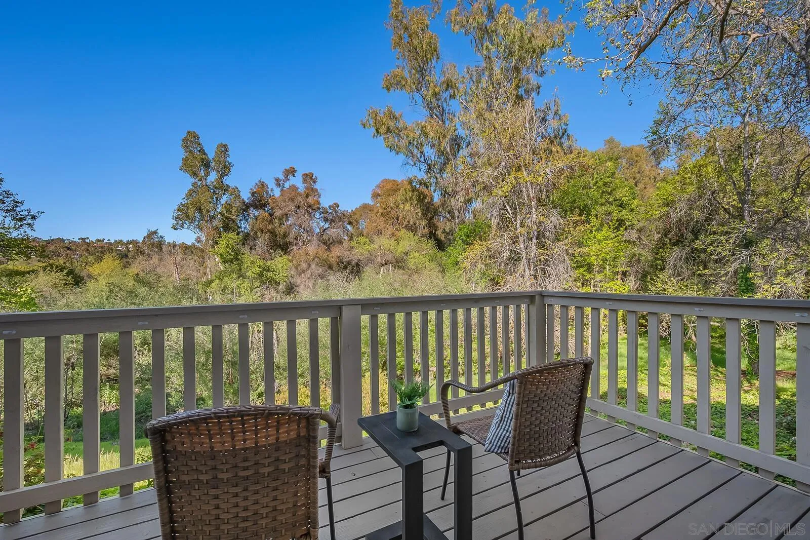 3040 Via De Caballo Encinitas, CA 92024 - Photo 17 of 39 a balcony with wooden floor and outdoor seating