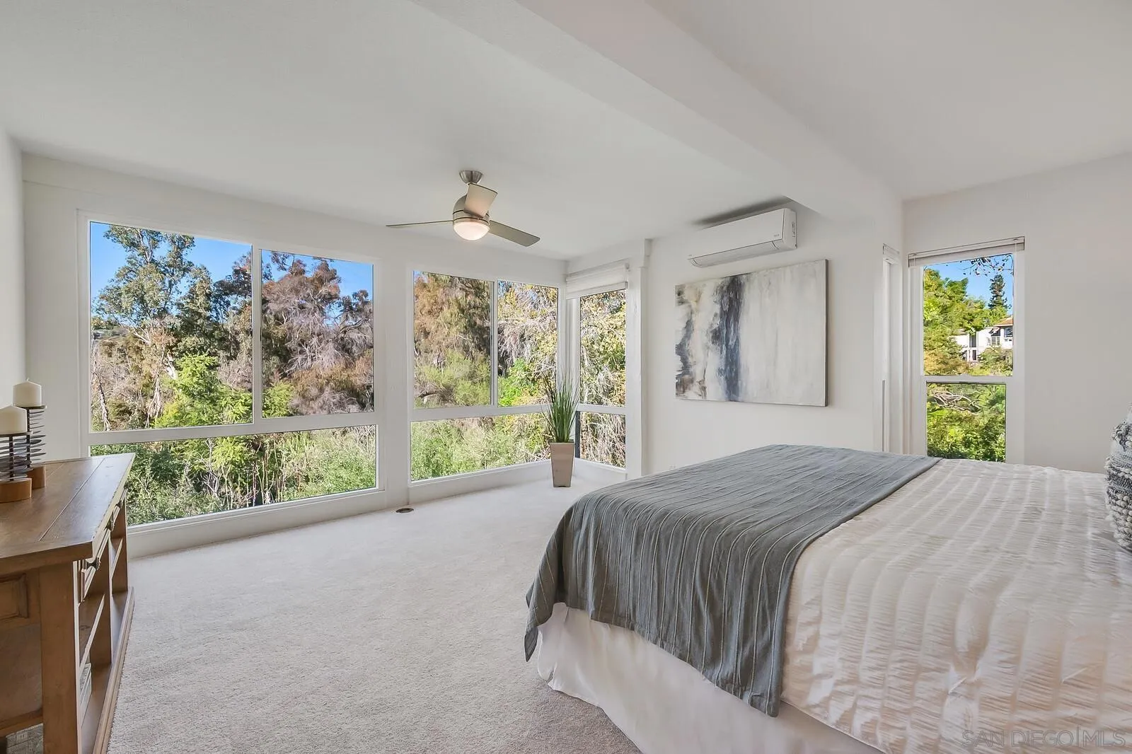3040 Via De Caballo Encinitas, CA 92024 - Photo 22 of 39 a bed sitting in a spacious bedroom next to a window