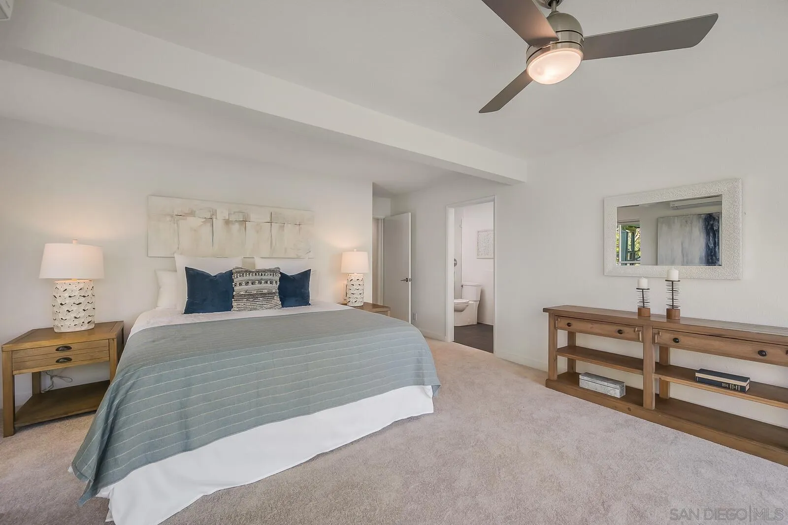 3040 Via De Caballo Encinitas, CA 92024 - Photo 24 of 39 a bedroom with a bed and a dresser