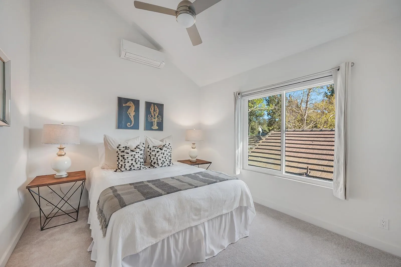 3040 Via De Caballo Encinitas, CA 92024 - Photo 30 of 39 a bedroom with a bed and a window