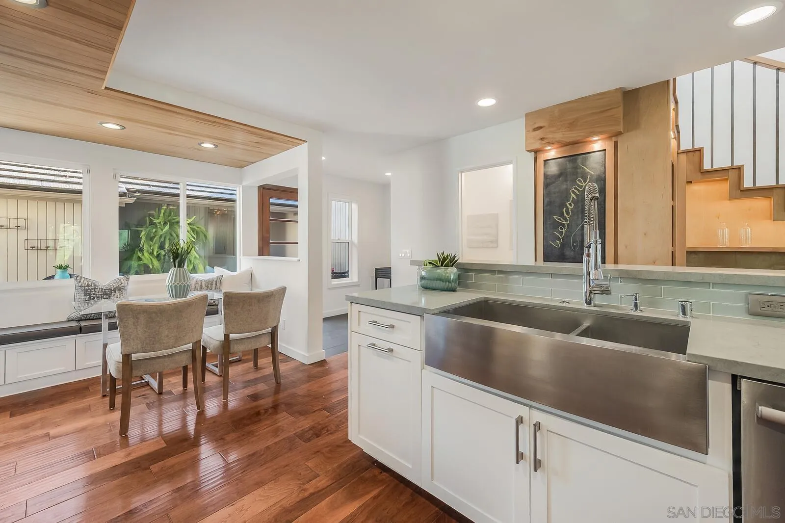 3040 Via De Caballo Encinitas, CA 92024 - Photo 8 of 39 a kitchen with center island table and chairs