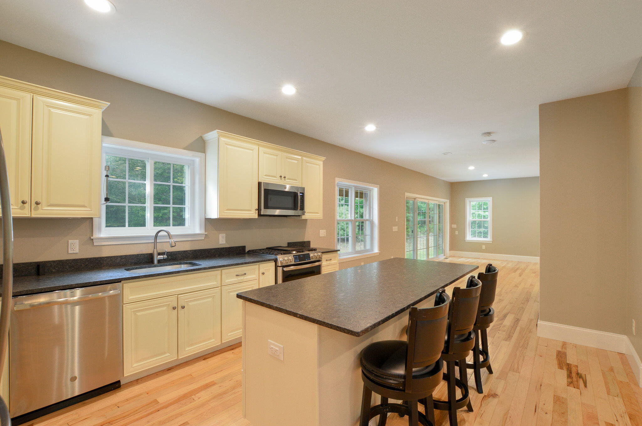 828 Cotuit Road Mashpee, MA 02649 - Photo 7 of 41 a kitchen with granite countertop a sink and cabinets