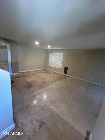 a kitchen with kitchen island a sink stainless steel appliances and window