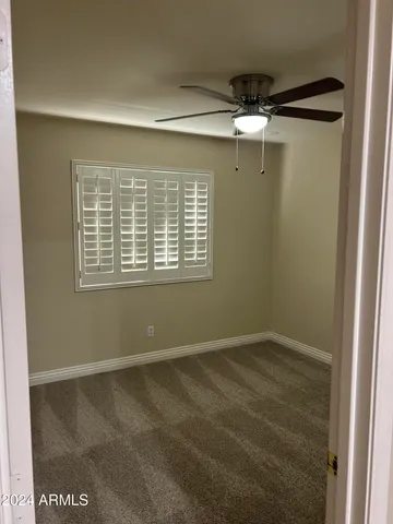 a view of empty room with windows