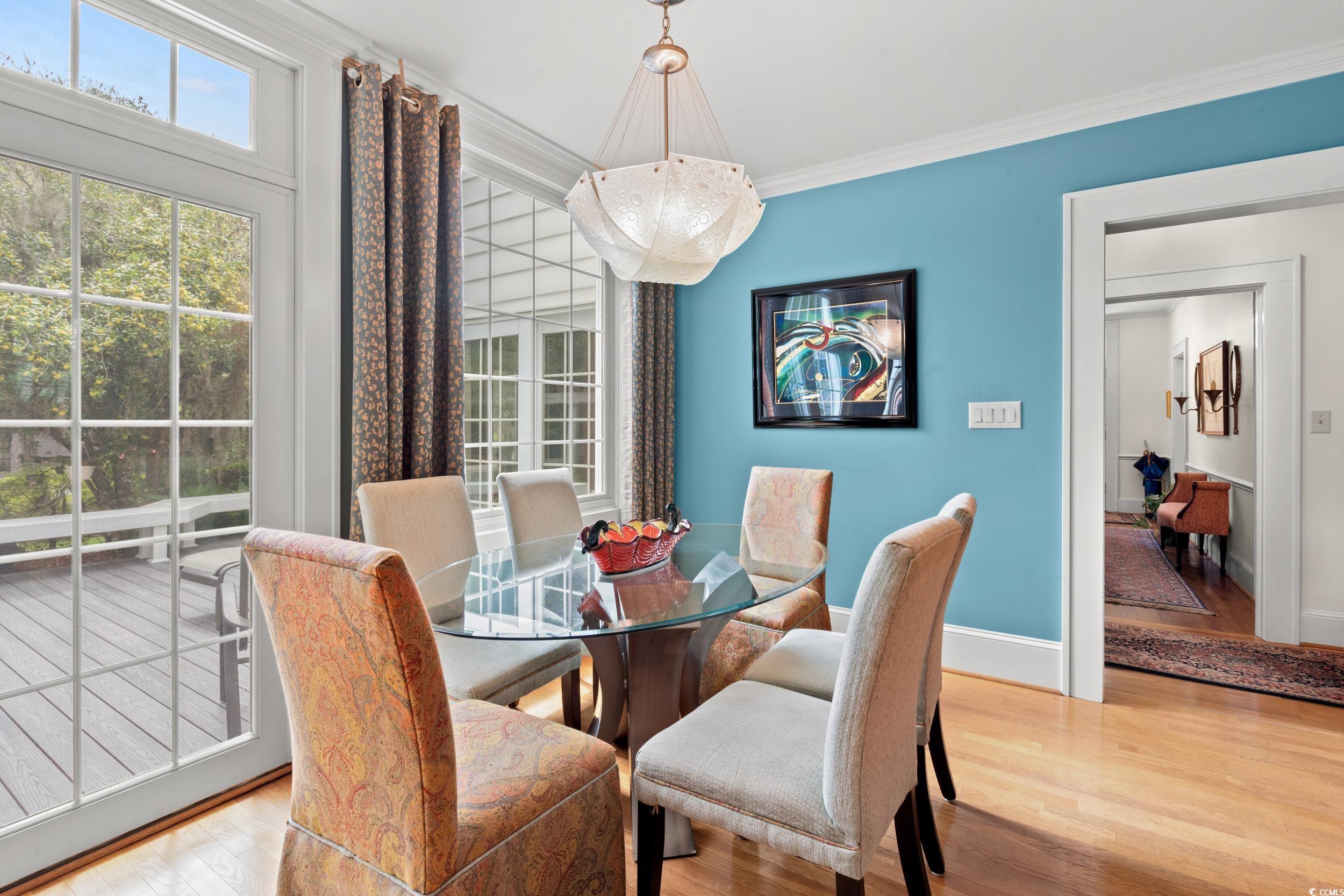 700 Lakeside Drive Conway, SC 29526 - Photo 12 of 40 Dining area featuring wood finished floors and ornamental molding