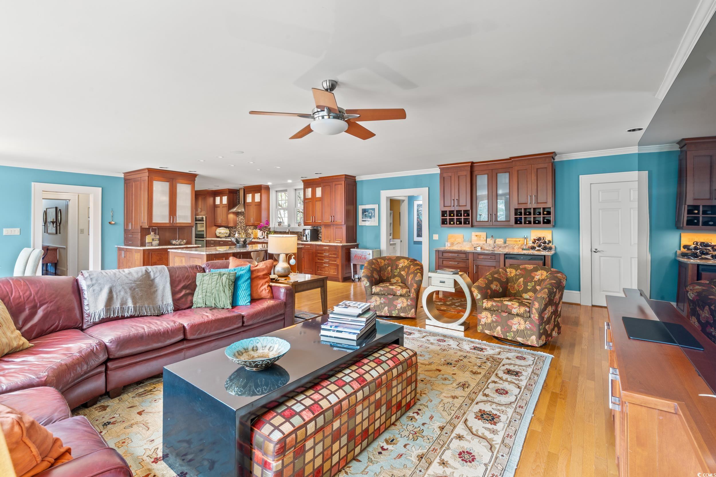 700 Lakeside Drive Conway, SC 29526 - Photo 15 of 40 Living room featuring ornamental molding, light wood-style flooring, and ceiling fan