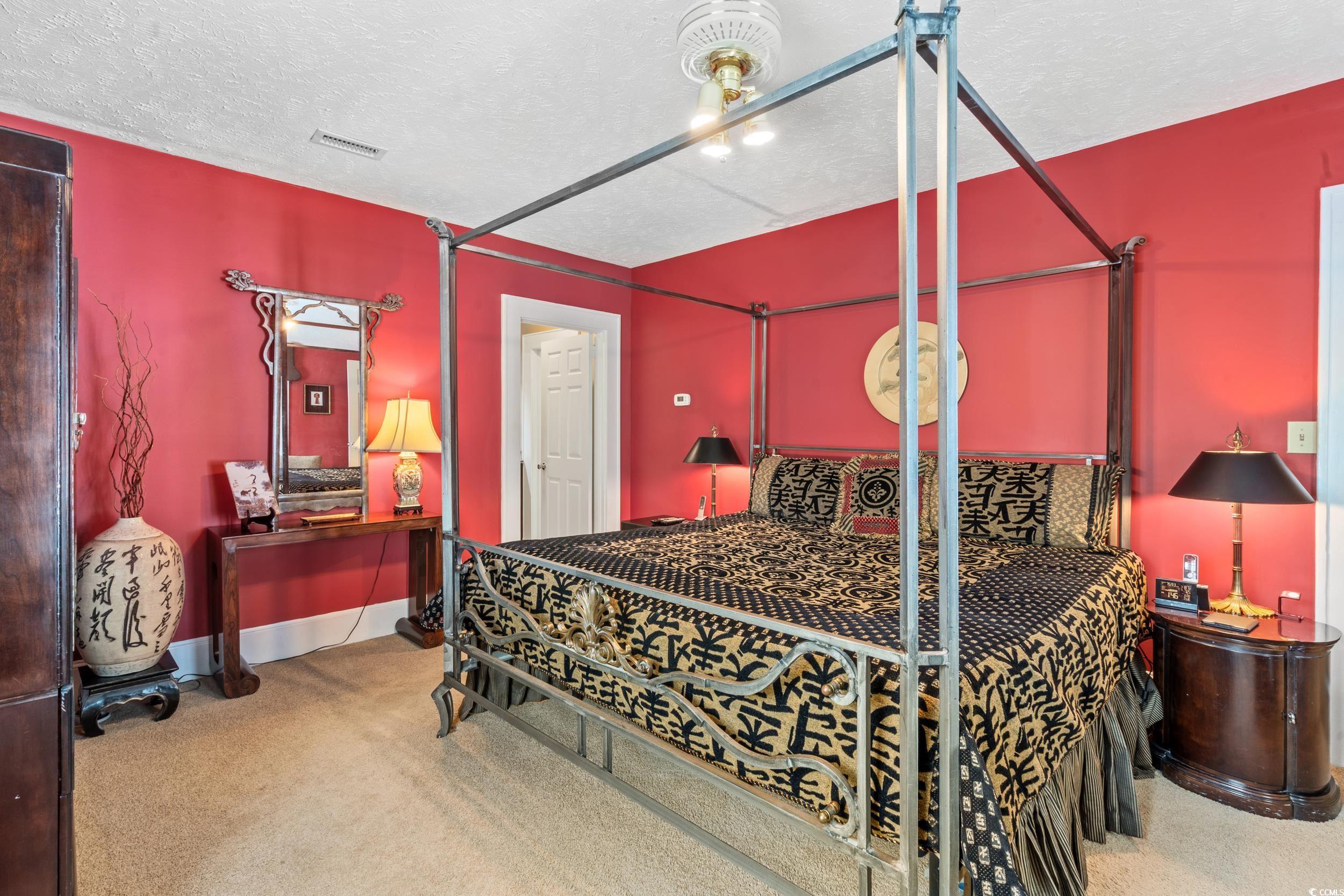 700 Lakeside Drive Conway, SC 29526 - Photo 18 of 40 Carpeted bedroom featuring a textured ceiling and baseboards