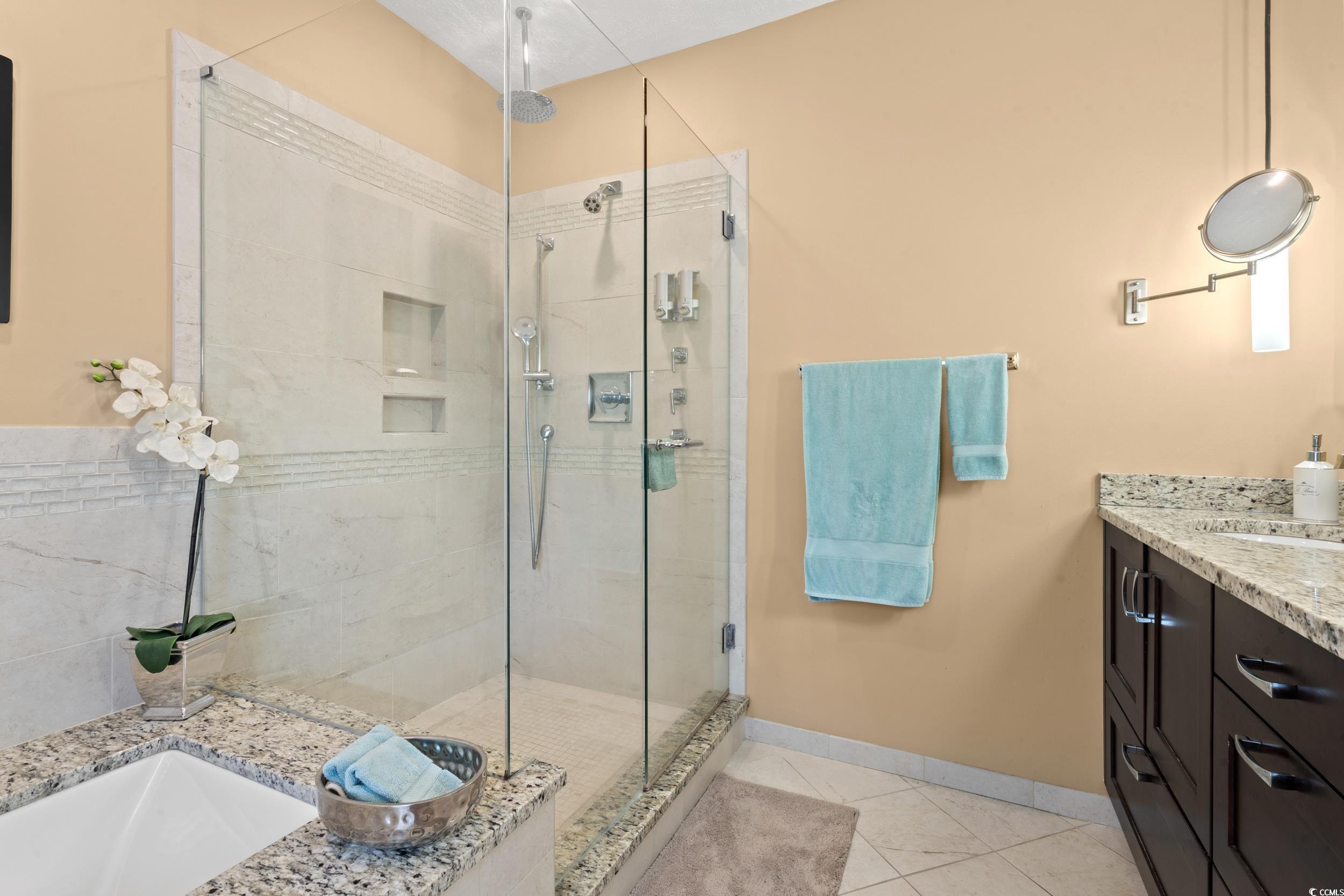700 Lakeside Drive Conway, SC 29526 - Photo 21 of 40 Bathroom featuring vanity, a stall shower, and light tile patterned flooring
