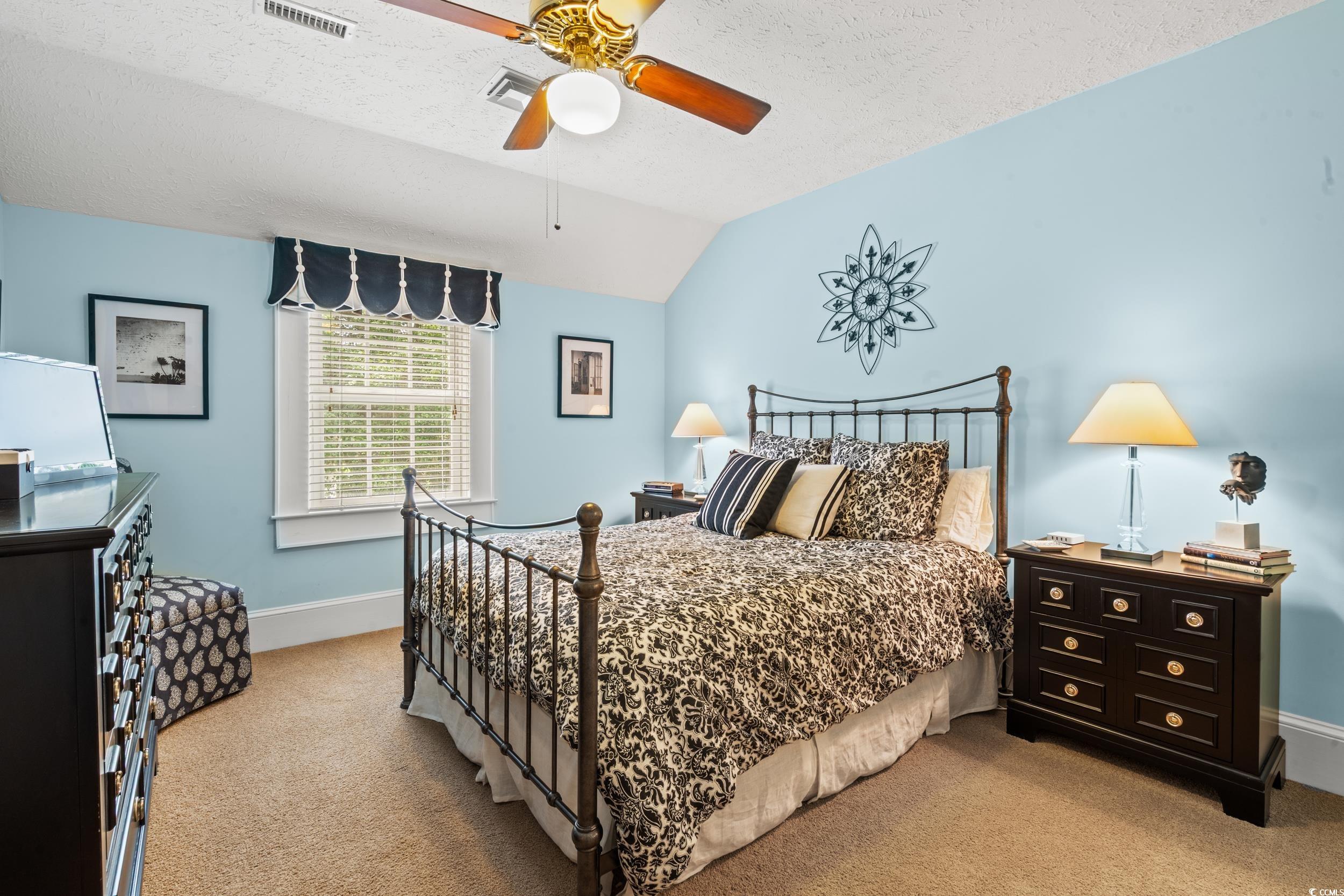 700 Lakeside Drive Conway, SC 29526 - Photo 23 of 40 Bedroom with light carpet, vaulted ceiling, a textured ceiling, and ceiling fan