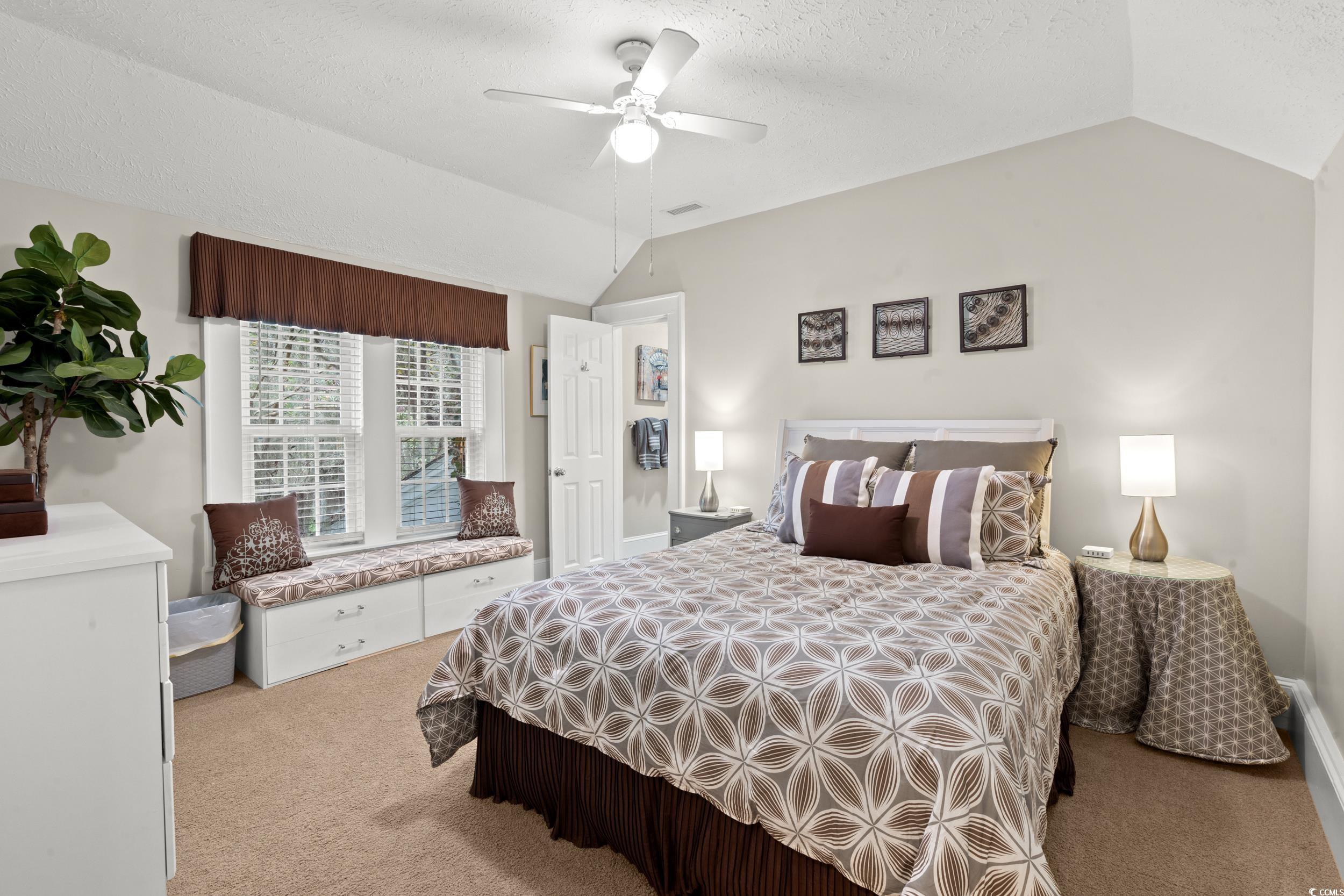 700 Lakeside Drive Conway, SC 29526 - Photo 25 of 40 Bedroom featuring lofted ceiling, light carpet, a textured ceiling, and ceiling fan