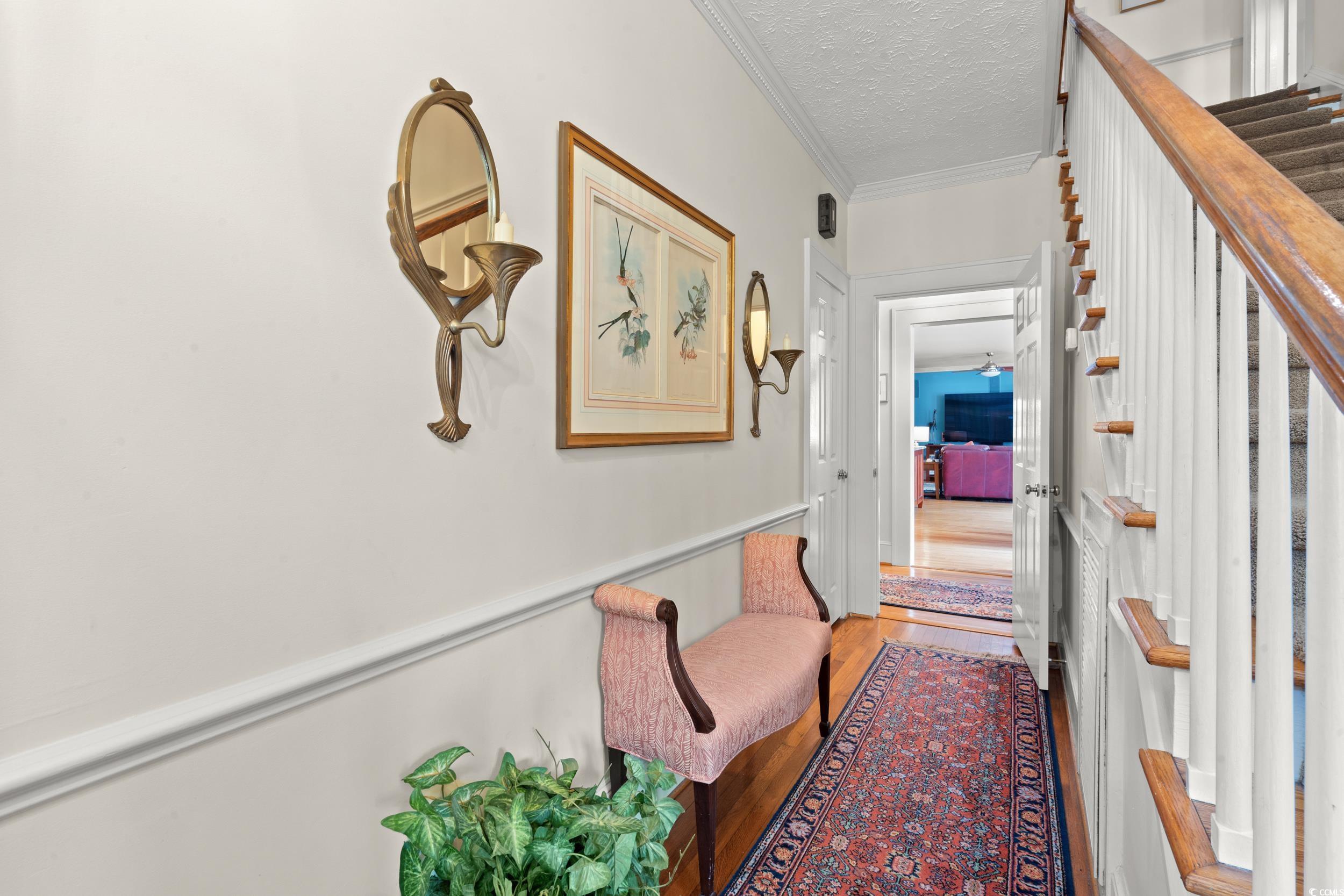 700 Lakeside Drive Conway, SC 29526 - Photo 3 of 40 Hallway featuring ornamental molding, a textured ceiling, and light wood-style floors