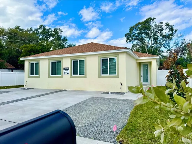 a house with trees in the background