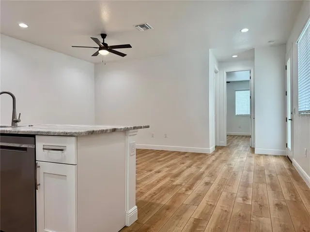 a view of a kitchen with a sink and dishwasher