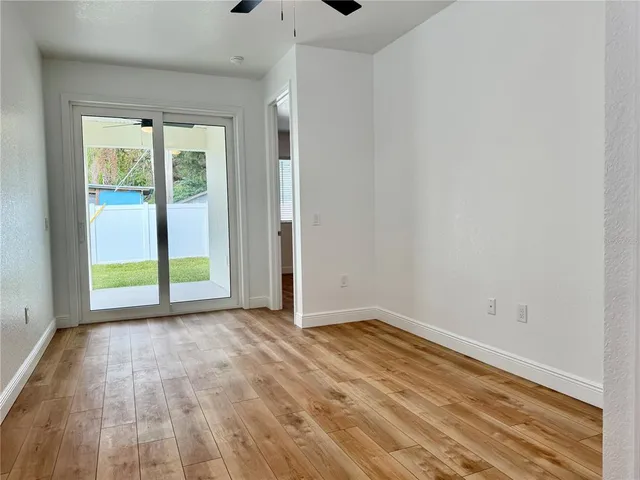 a view of an empty room with glass door