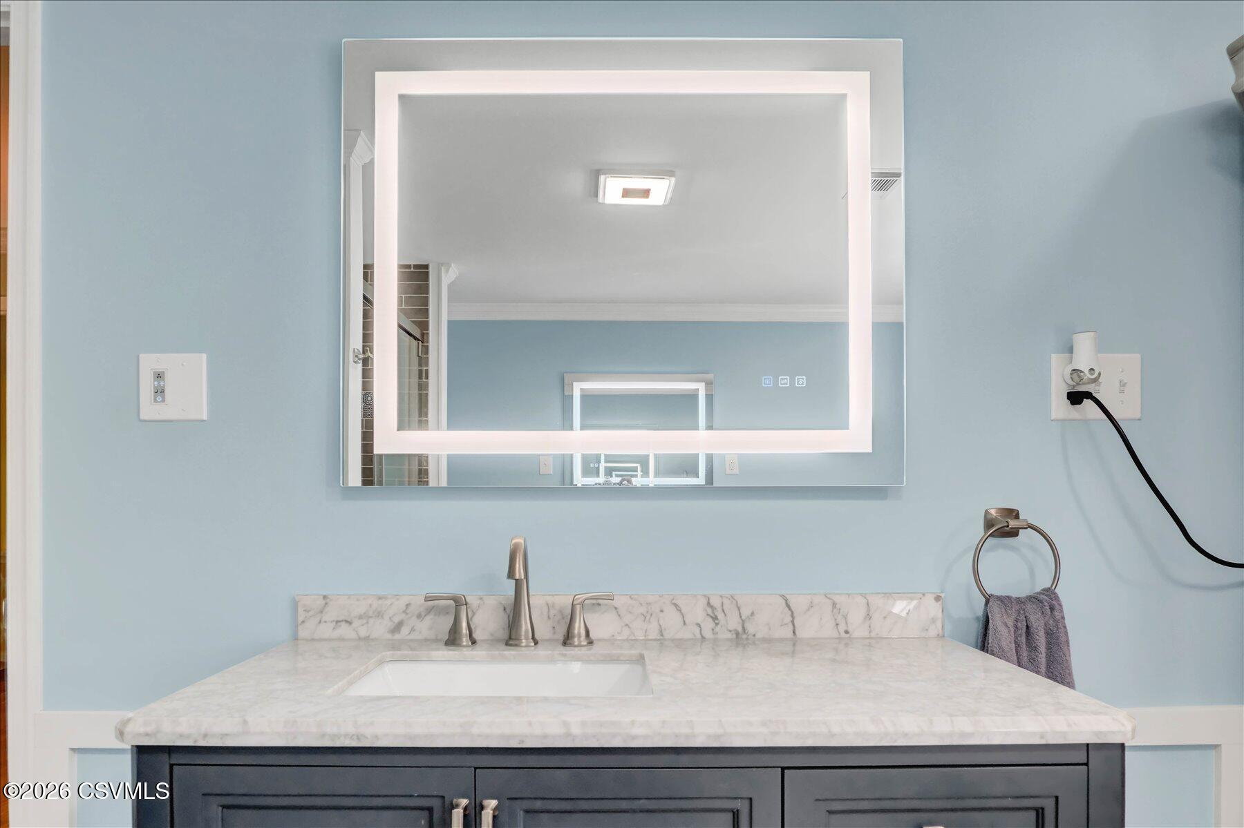 65 Crestview Drive Winfield, PA 17889 - Photo 29 of 70 a bathroom with a sink and a mirror