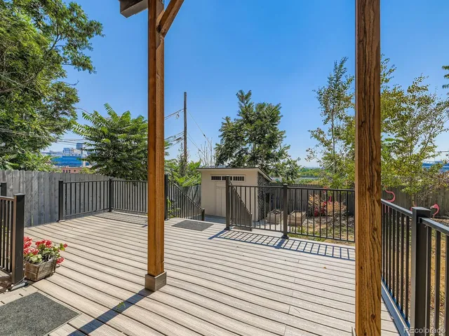 a view of a balcony with wooden floor