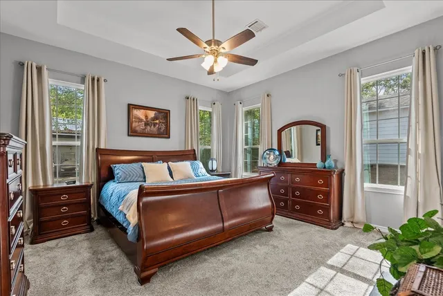 a bed room with a bed and a dresser