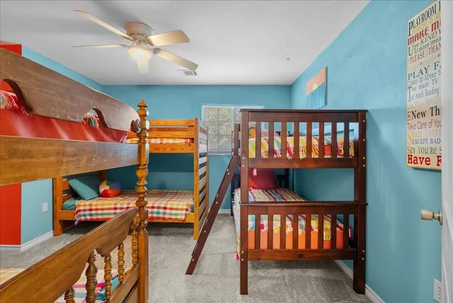 a bedroom with furniture and a baby crib