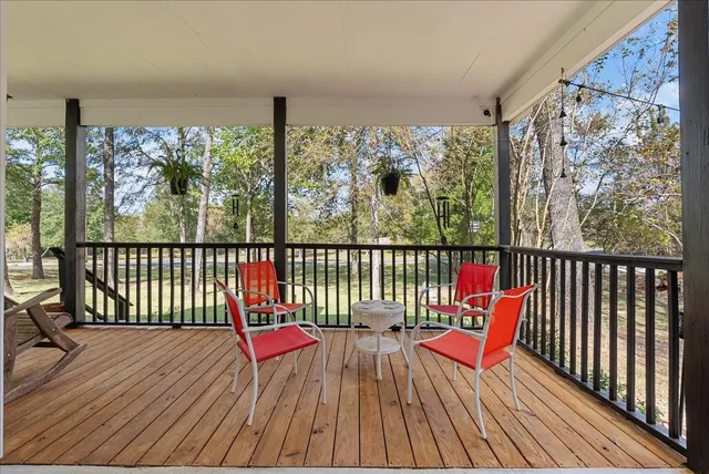 a view of balcony with wooden floor