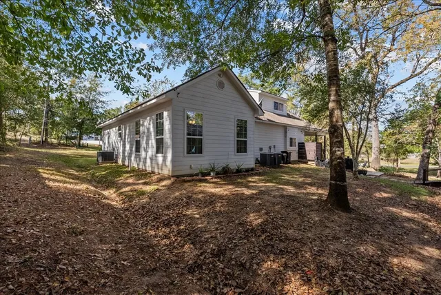 a backyard of a house with lots of green space