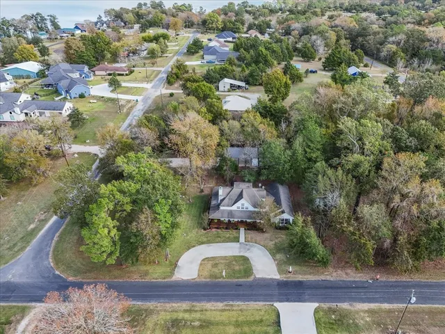 an aerial view of a house with swimming pool